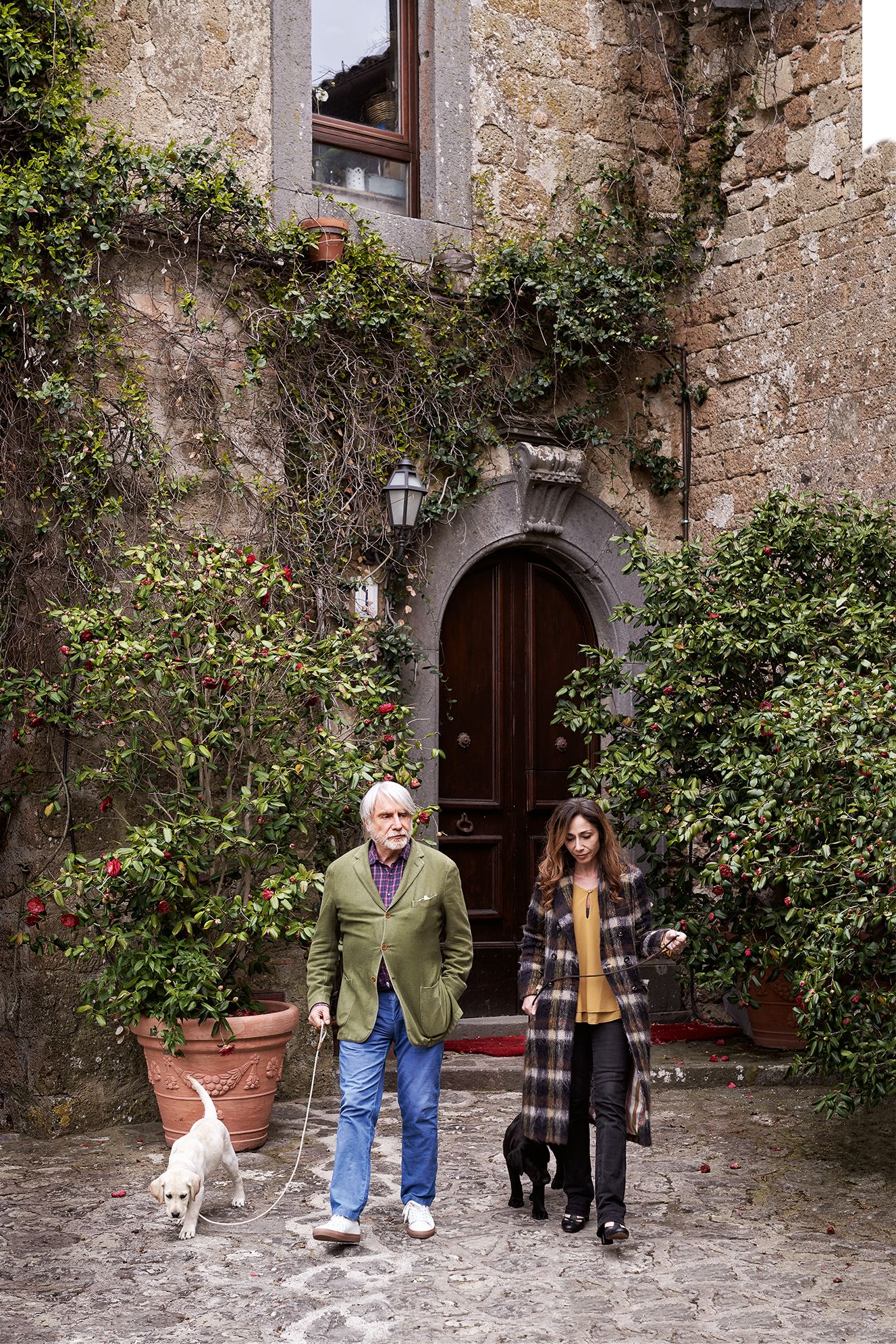 Image may contain Clothing Shoe Footwear Apparel Human Person Flagstone Animal Pet Canine Dog and Mammal