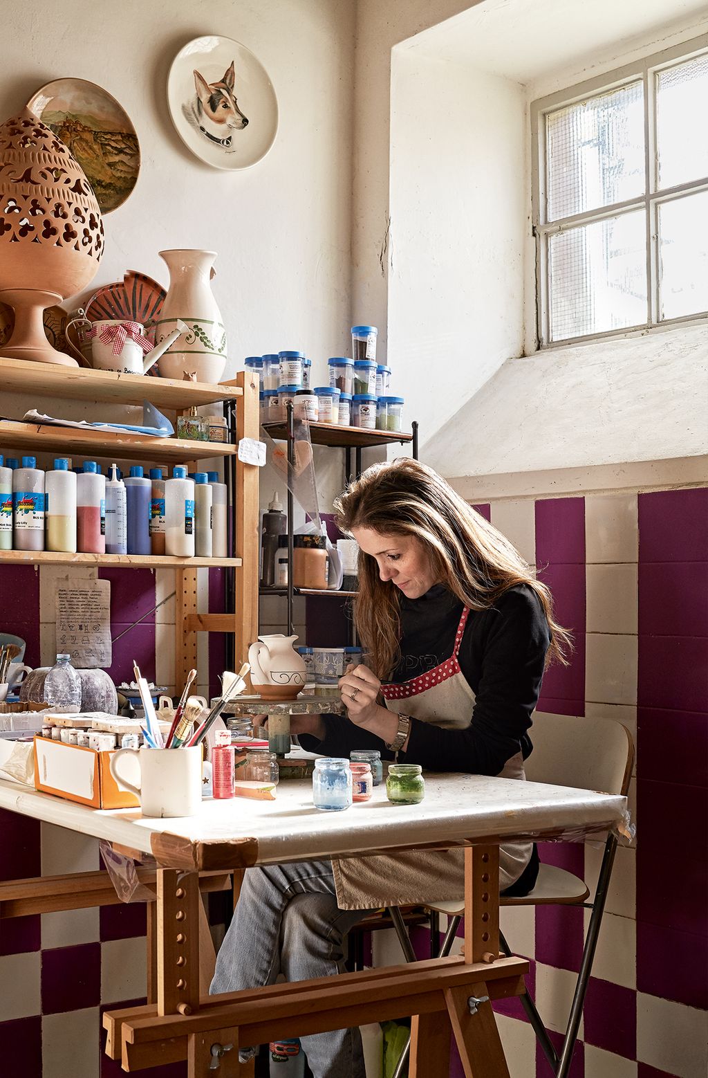 Image may contain Shelf Furniture Human Person Plywood Wood Chair and Table