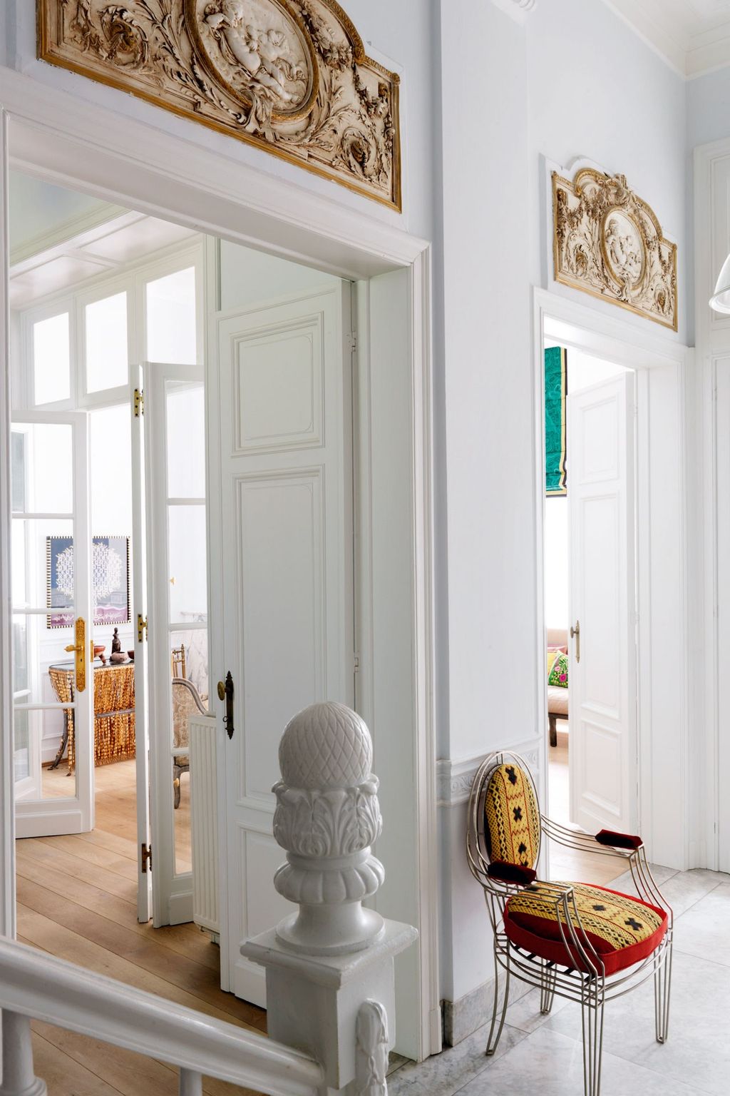 Image may contain Furniture Chair Home Decor Interior Design Indoors Corner Door Flooring and Floor