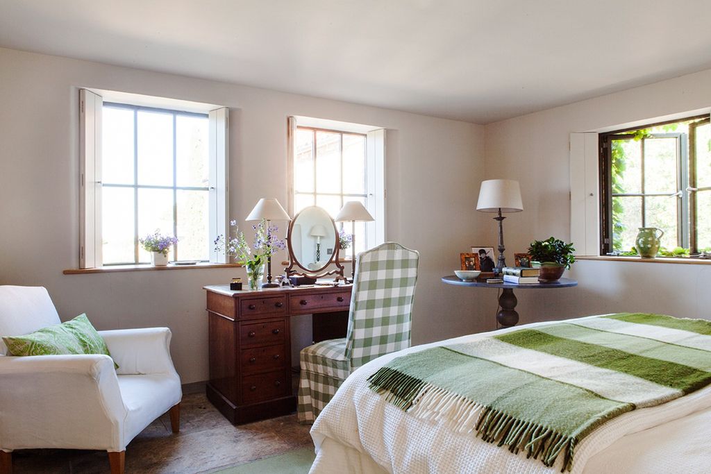 Image may contain Furniture Room Bedroom Indoors Interior Design Home Decor Bed Living Room and Rug