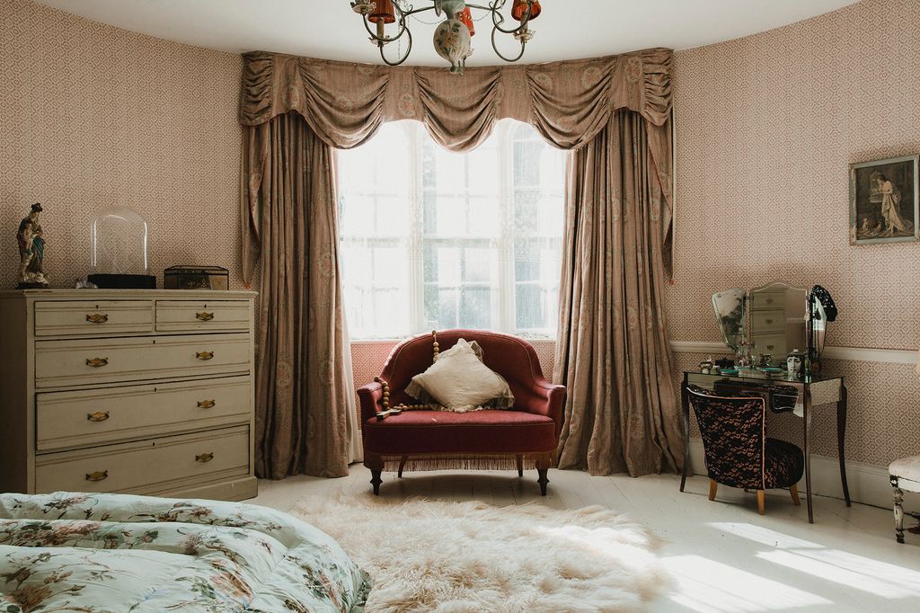 Image may contain Furniture Living Room Indoors Room and Rug