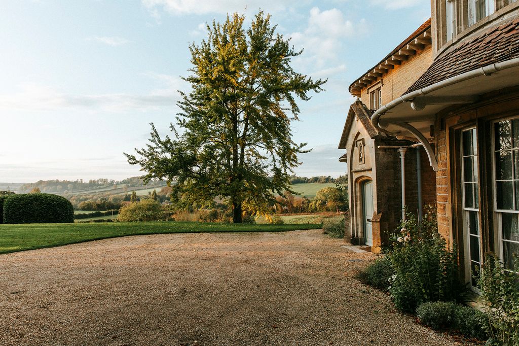 Image may contain Road Dirt Road Gravel Plant Tree Outdoors Ground Housing and Building