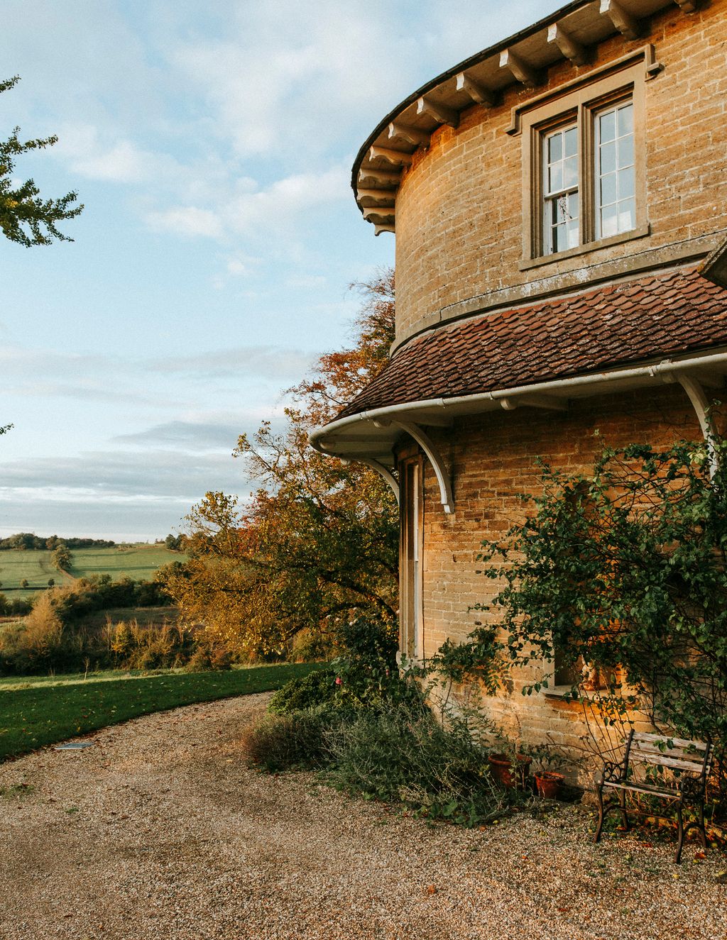 Image may contain Outdoors Roof Nature Tree Plant Gravel Road and Dirt Road