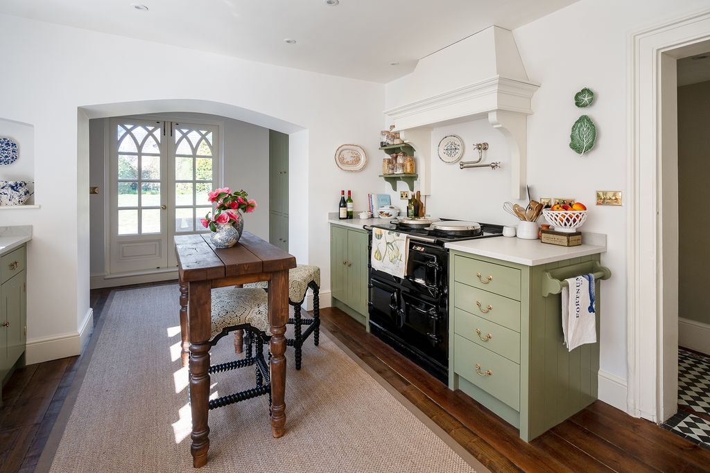 Image may contain Room Indoors Flooring Wood Hardwood Kitchen Interior Design Living Room and Floor