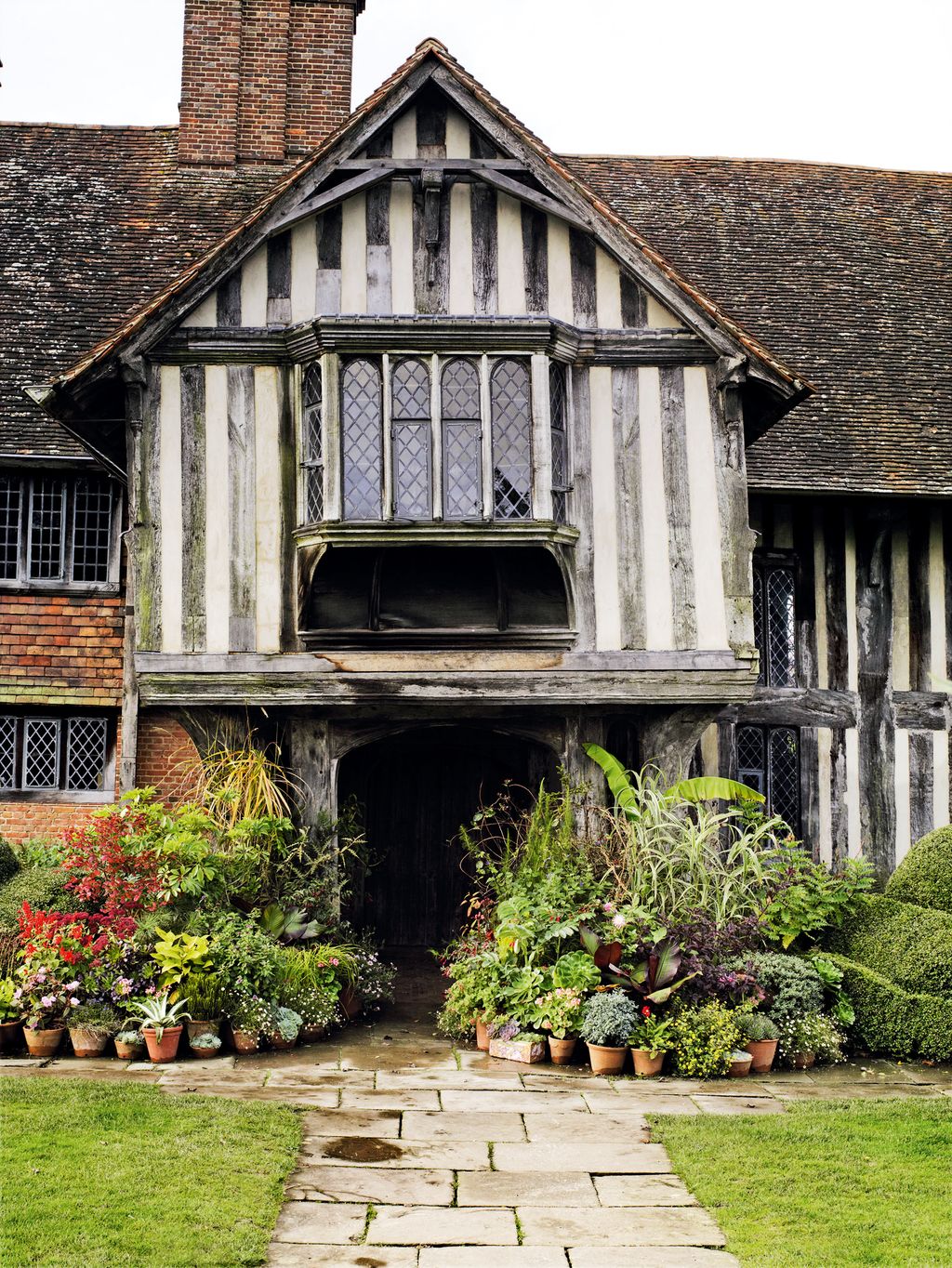 Image may contain Outdoors Nature Building Cottage Housing House Roof Vase Plant Pottery Potted Plant and Jar