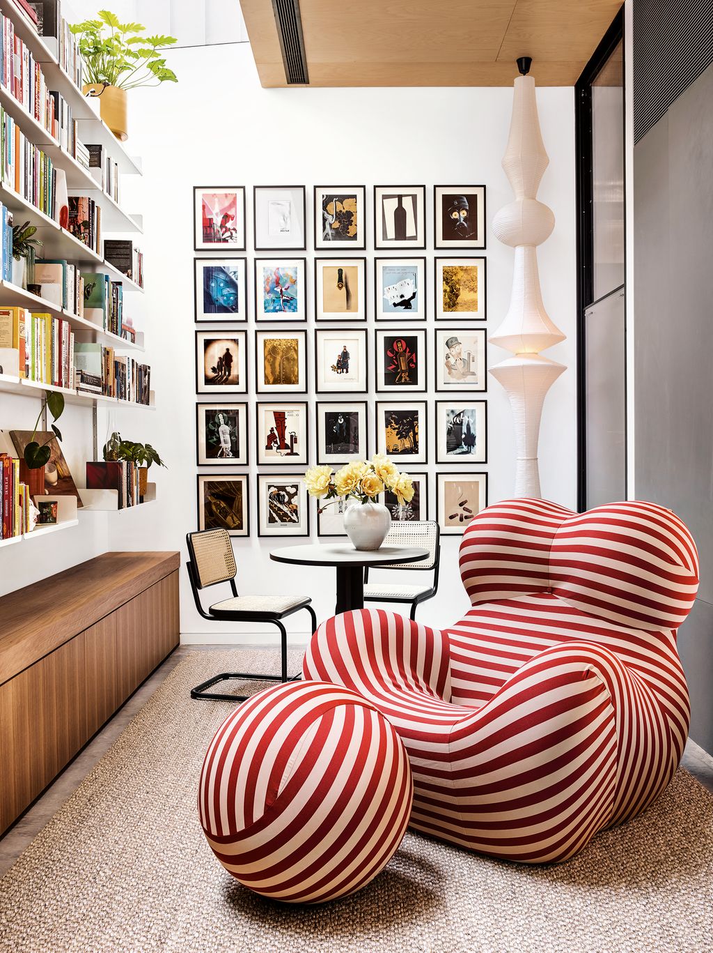 Image may contain Furniture Shelf Rug Indoors Room Interior Design Living Room and Bookcase