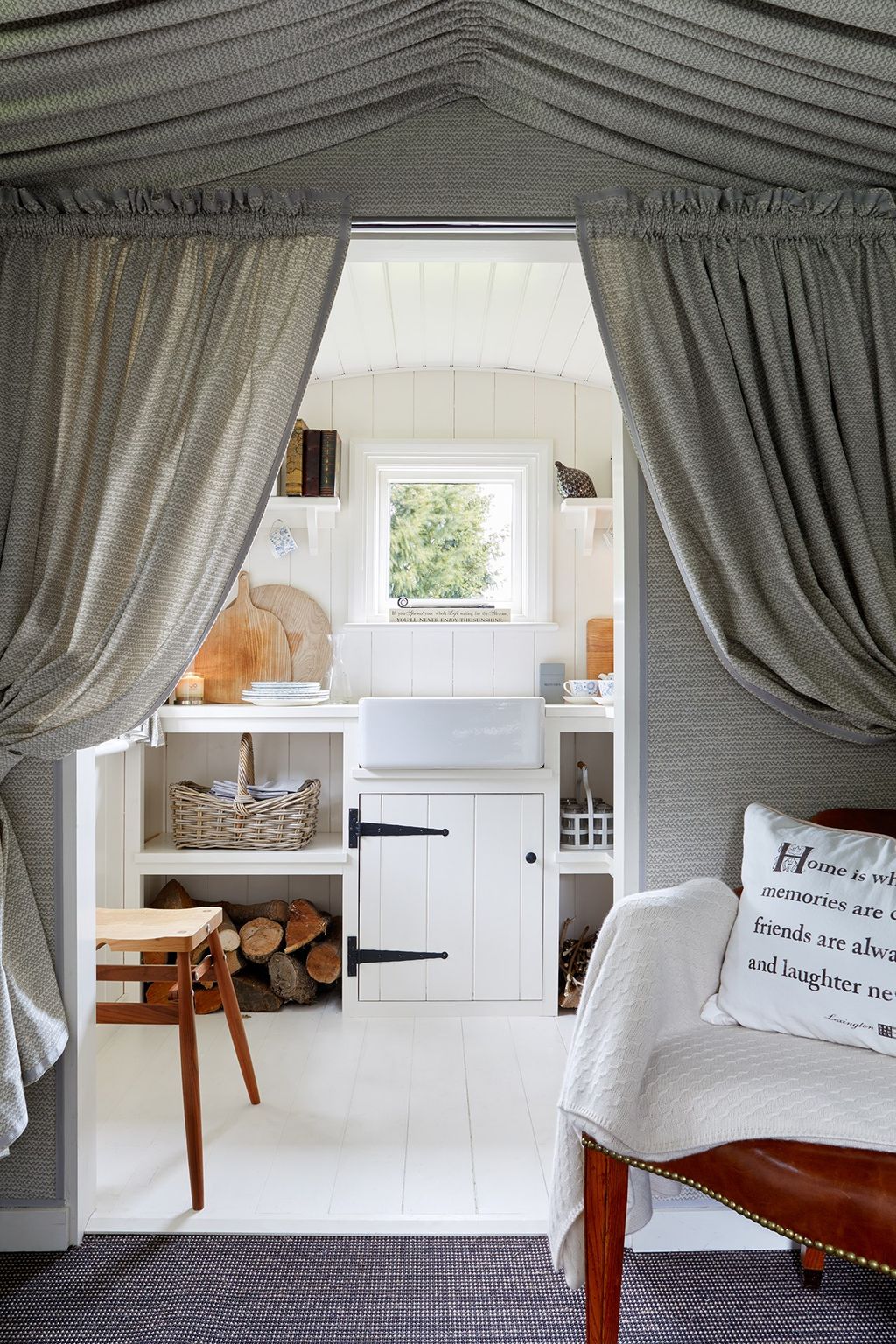 Image may contain Furniture Room Indoors Living Room Wood Home Decor Interior Design and Cushion