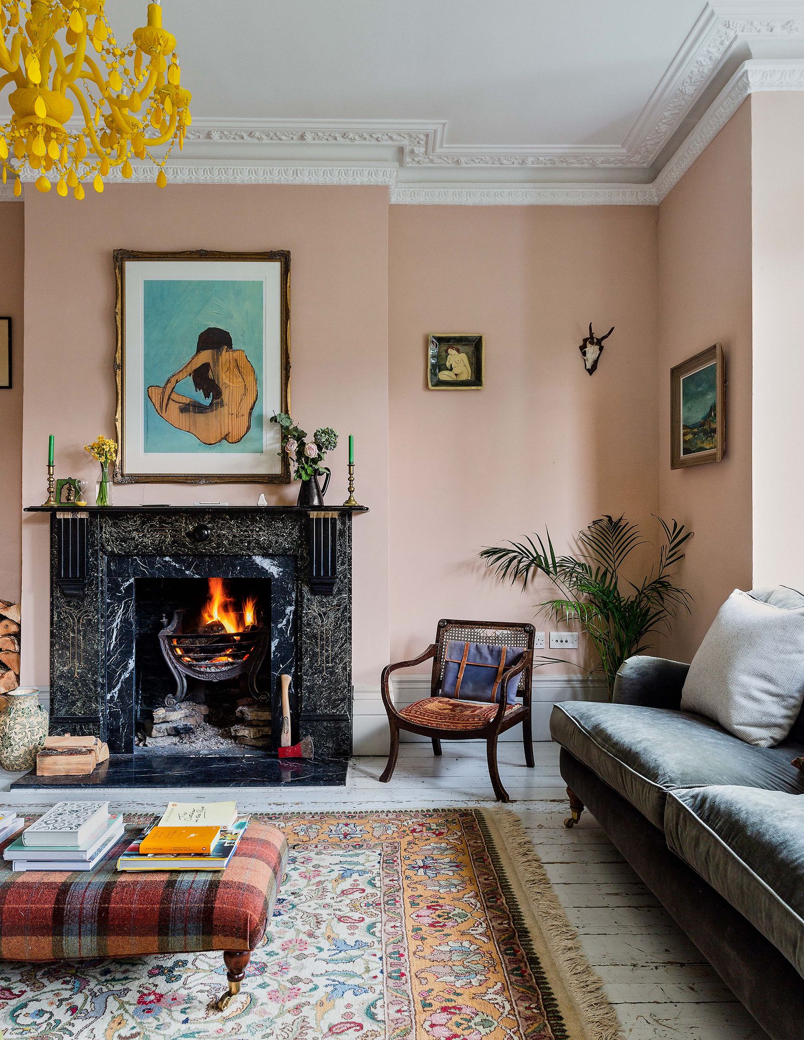 Image may contain Living Room Room Indoors Fireplace Interior Design Furniture Couch Home Decor Rug and Hearth