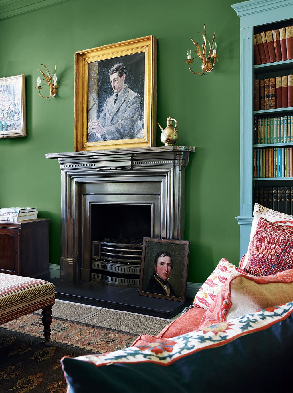 Image may contain Furniture Human Person Fireplace Indoors Cushion Living Room Room Home Decor and Manolete