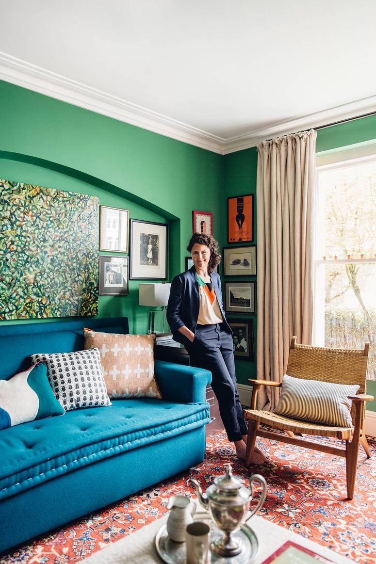 Image may contain: Couch, Furniture, Human, Person, Living Room, Indoors, Room, and Rug