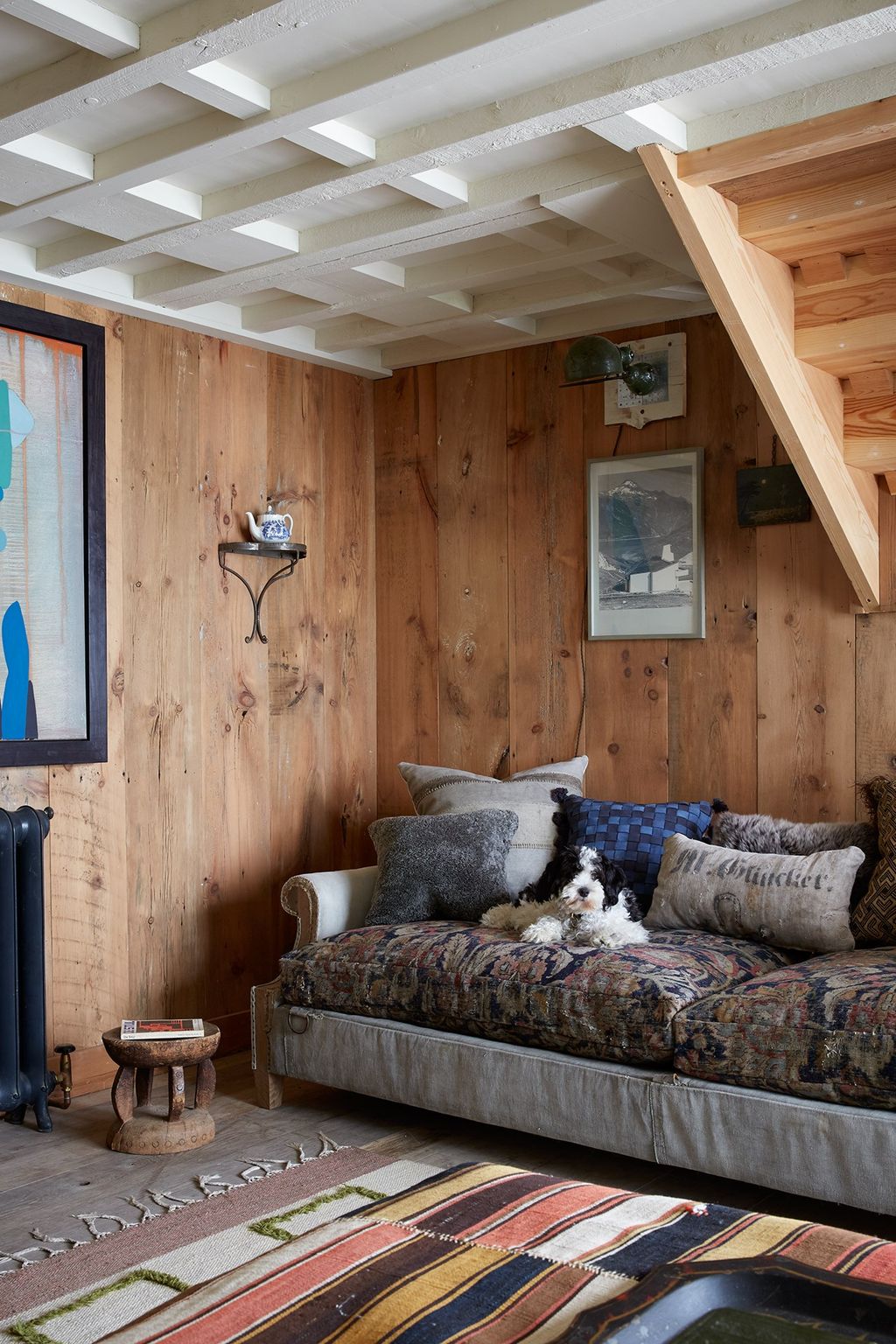 Antiques are featured in clever ways throughout the house such as a small teapot displayed on a miniature shelf in the...