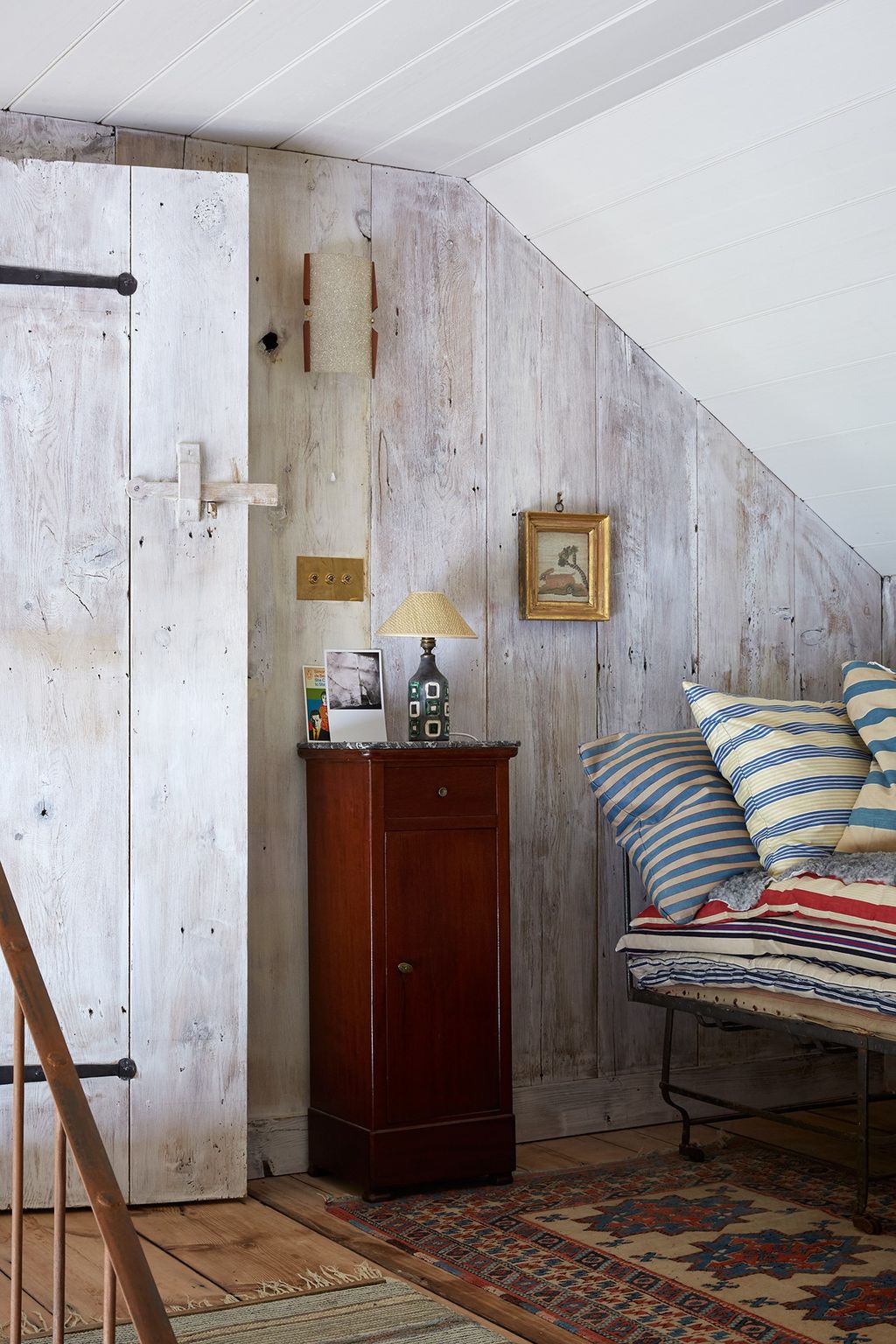 Image may contain Wood Furniture Interior Design Indoors Room Bedroom Living Room Housing Building and Cushion