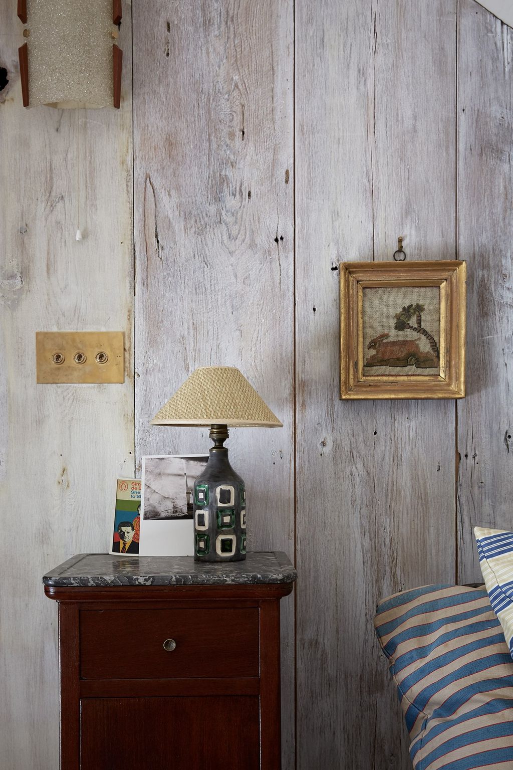 Image may contain Furniture Cushion Pillow Wood Lamp Hardwood Living Room Room Indoors and Interior Design