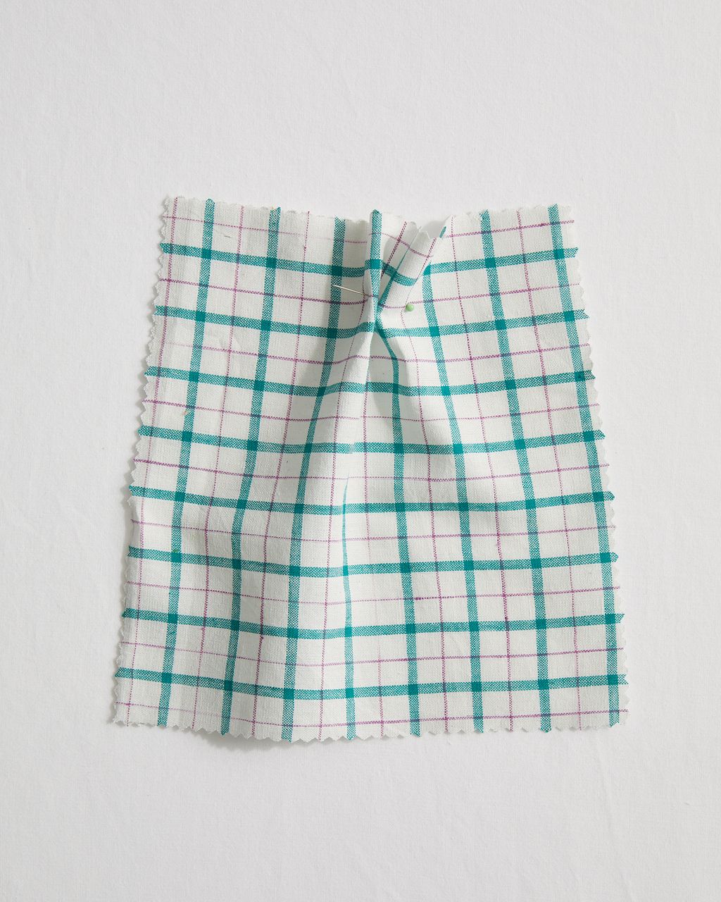 Image may contain Home Decor Clothing Apparel Skirt and Linen