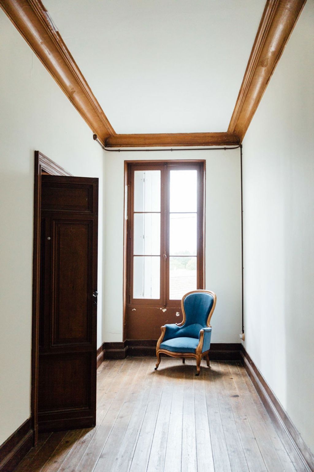 In food writer Mimi Thorisson's home in France warmth and definition is added to a white minimal hallway with scrubbed...