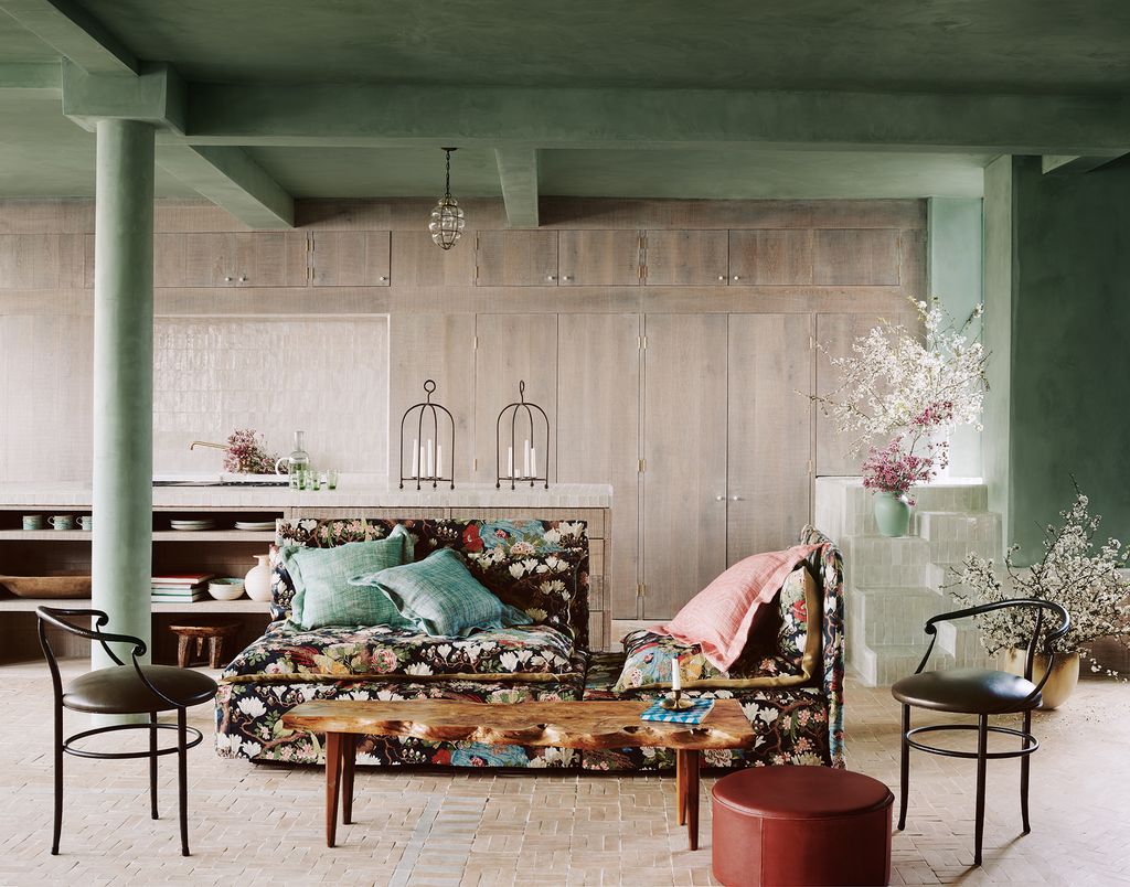 Image may contain Living Room Indoors Room Furniture Couch Table Coffee Table Cushion Chair and Pillow