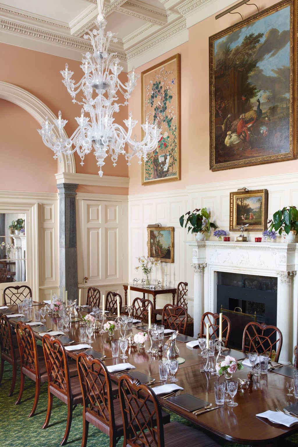 A Venetian glass chandelier hangs above the mahogany table in the dining room.