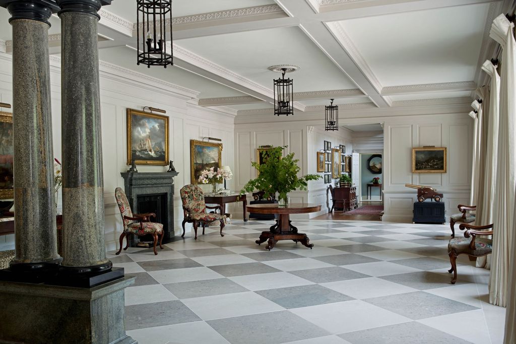 Image may contain Flooring Floor Indoors Lobby Room Furniture Chair and Living Room