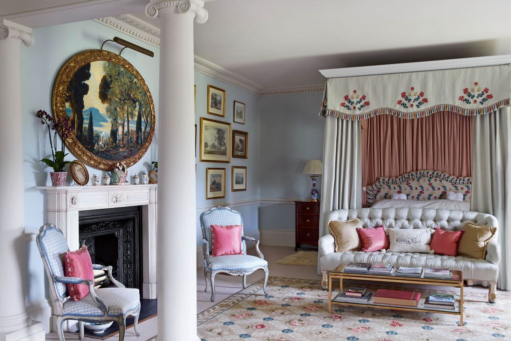 A pair of French armchairs and a sofa upholstered in 'Chloe' from George Spencer Designs create a pretty effect in the...