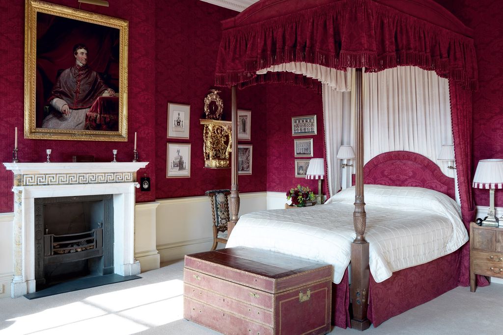 Image may contain Indoors Room Bedroom Furniture Bed Human Person Fireplace and Interior Design