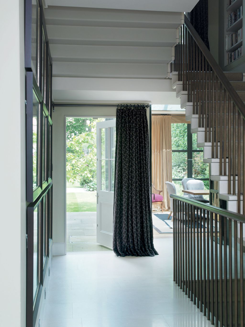 The broad hallway runs from the front to the back of the house.