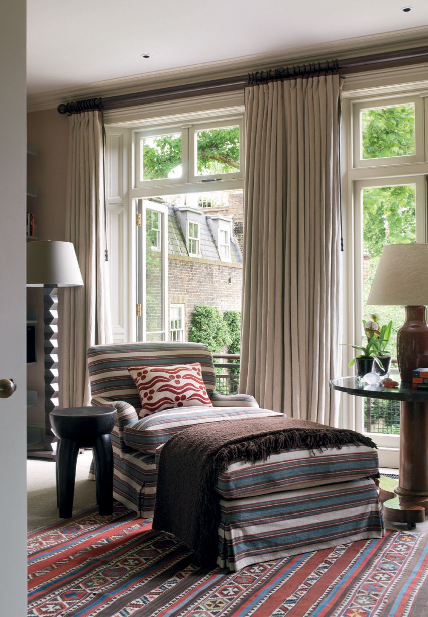 Image may contain Indoors Room Bedroom Furniture Rug Lamp and Table Lamp