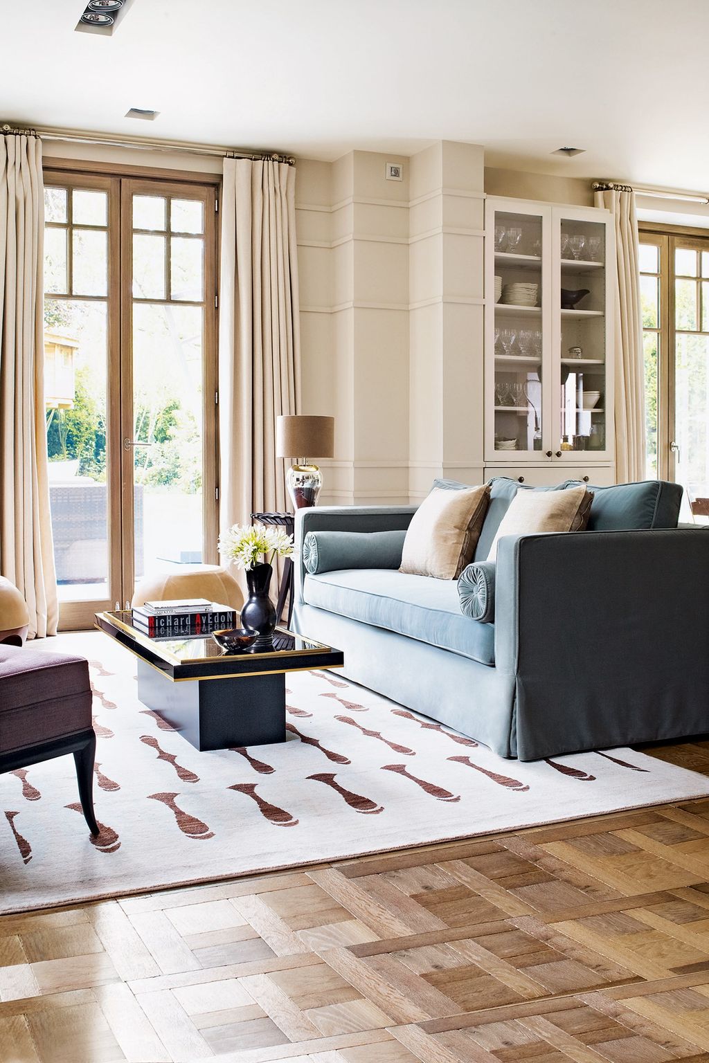 Floortoceiling french windows were added to connect the main sitting area with the new terrace and garden.