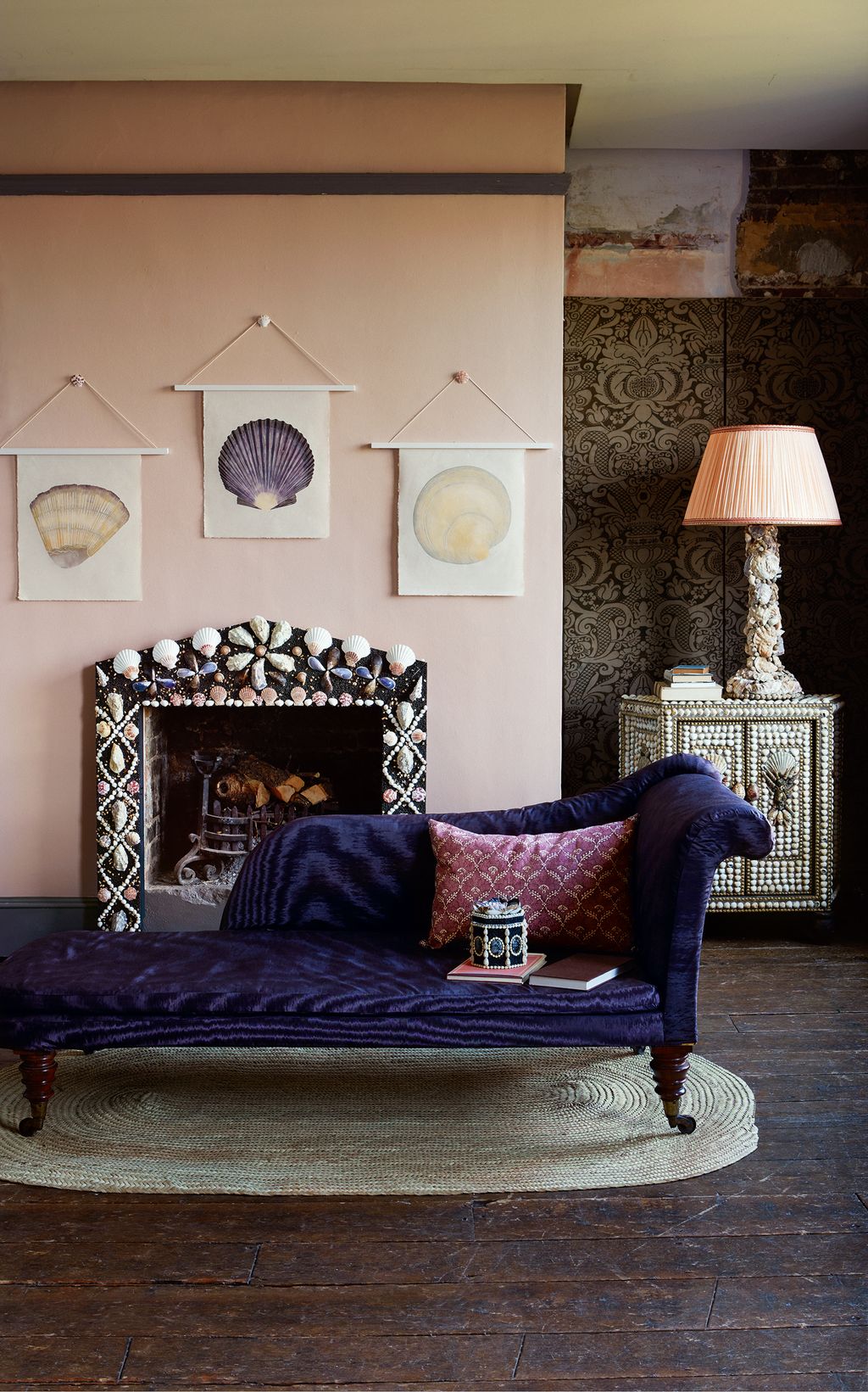 Image may contain Furniture Couch Lamp Table Lamp Hearth Living Room Indoors and Room