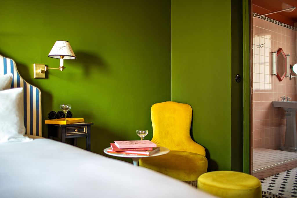 Image may contain Furniture Living Room Room Indoors Bed Chair Interior Design Couch Lighting and Lamp