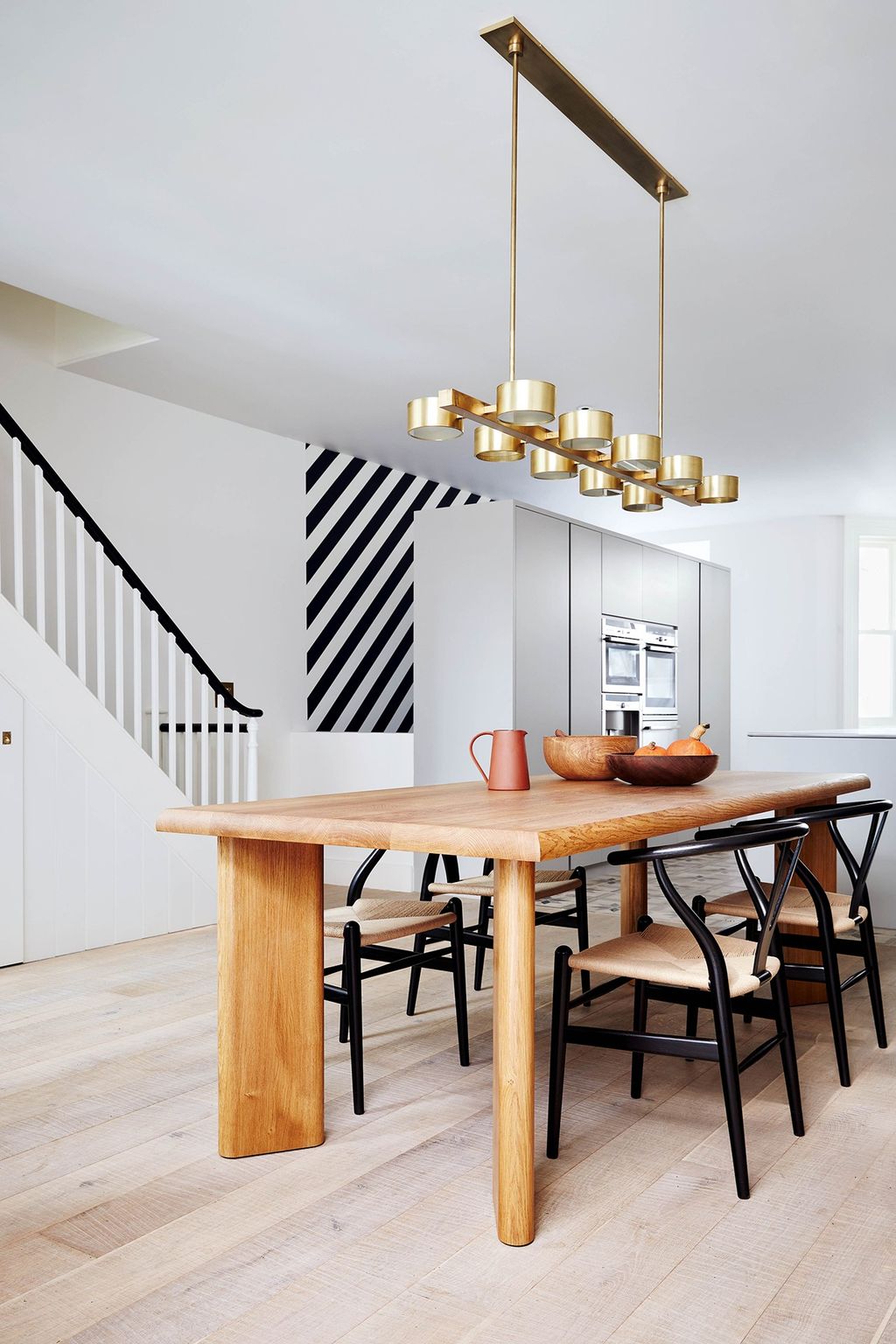 Image may contain Furniture Dining Table Table Indoors Chair Room Dining Room Interior Design and Wood