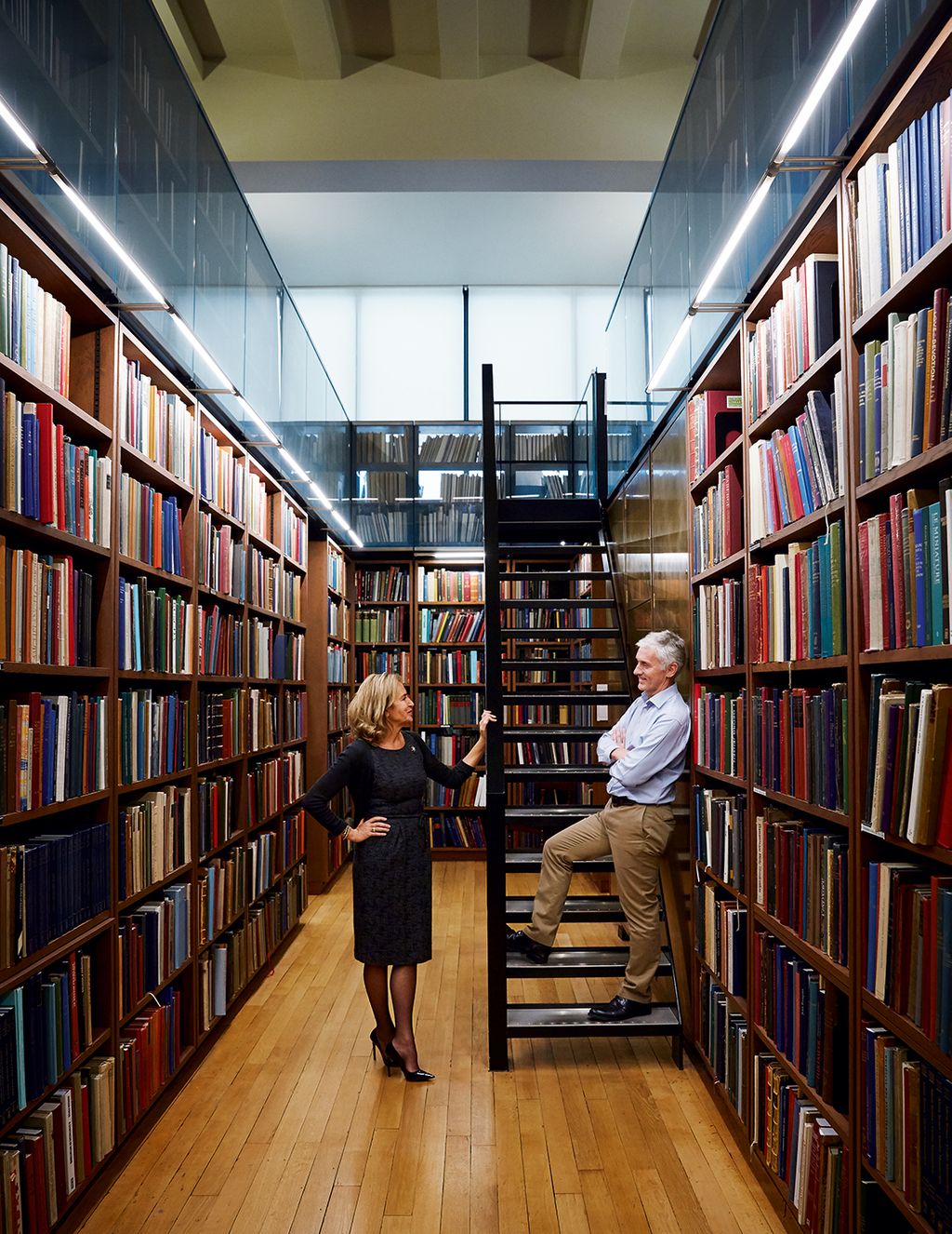 Image may contain Indoors Human Person Room Book Library Shelf Furniture and Bookcase