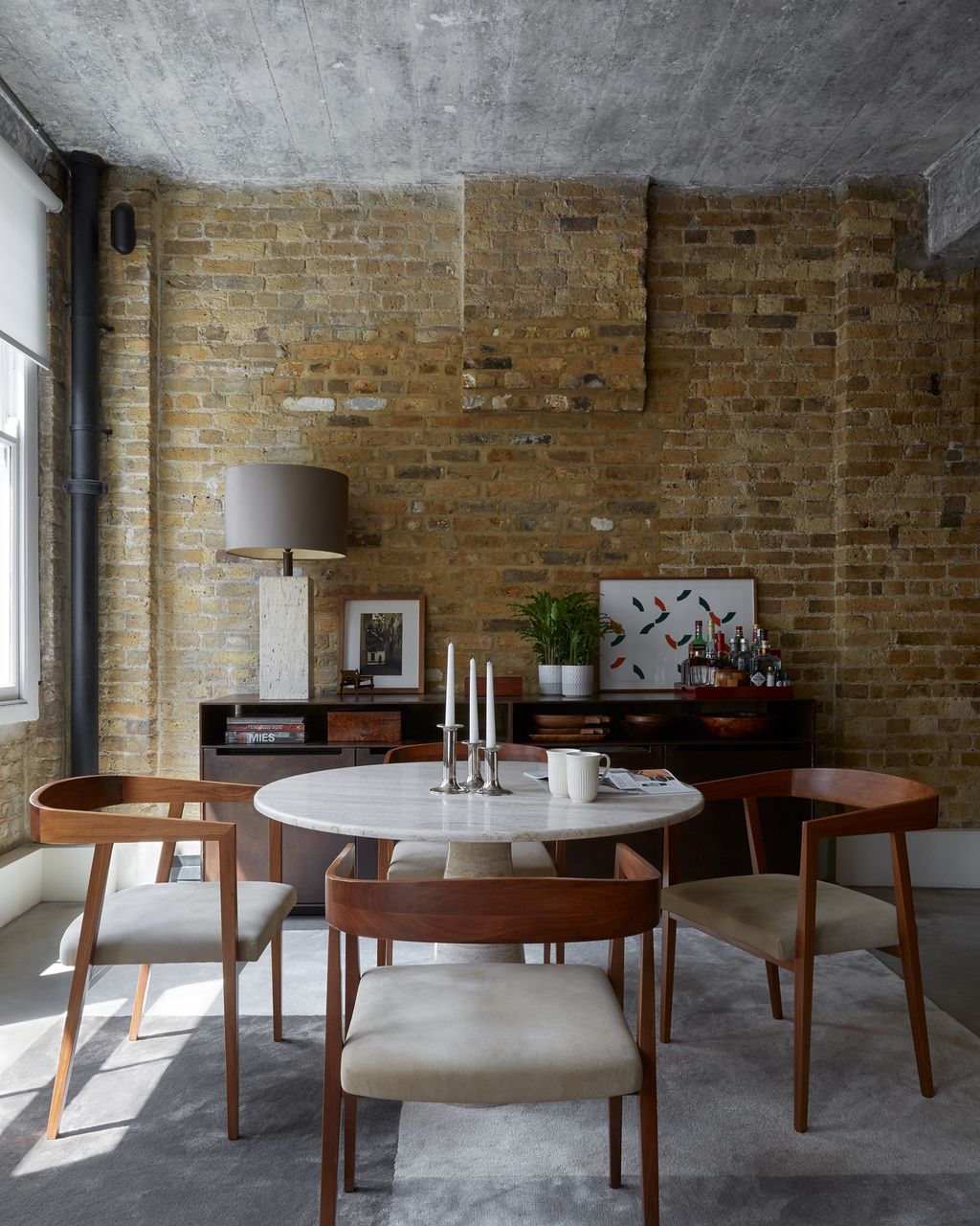 The dining table is a 1970s Italian design by Angelo Mangiarotti made in Travertine marble and was a present to Rients...