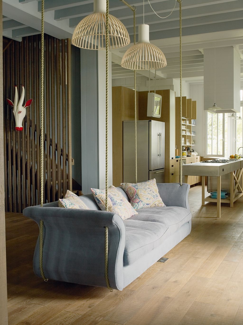 Image may contain Living Room Room Indoors Furniture Couch Flooring Wood Interior Design Floor and Hardwood