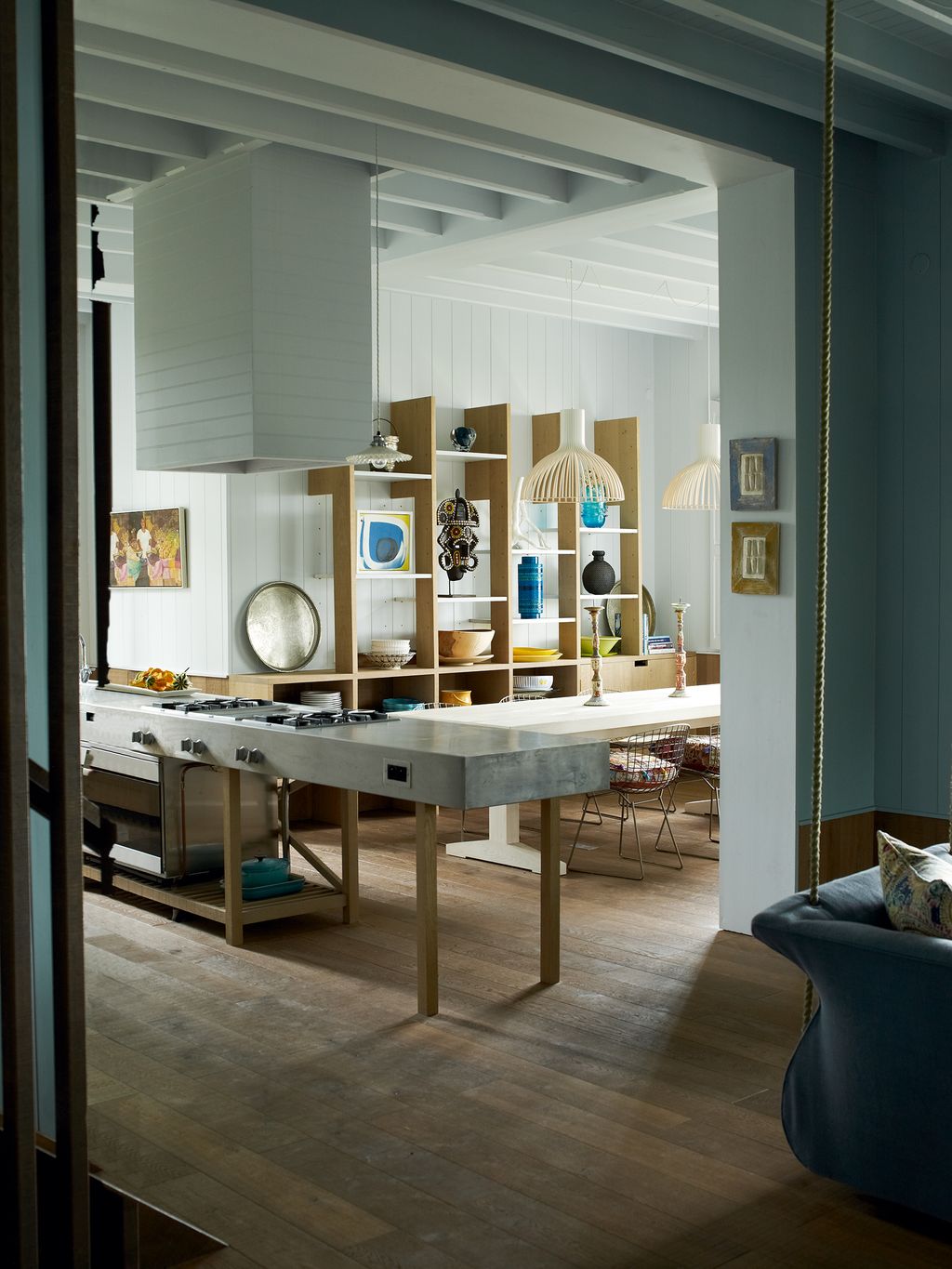 Image may contain Furniture Wood Flooring Indoors Room Floor Interior Design Living Room Lighting and Housing