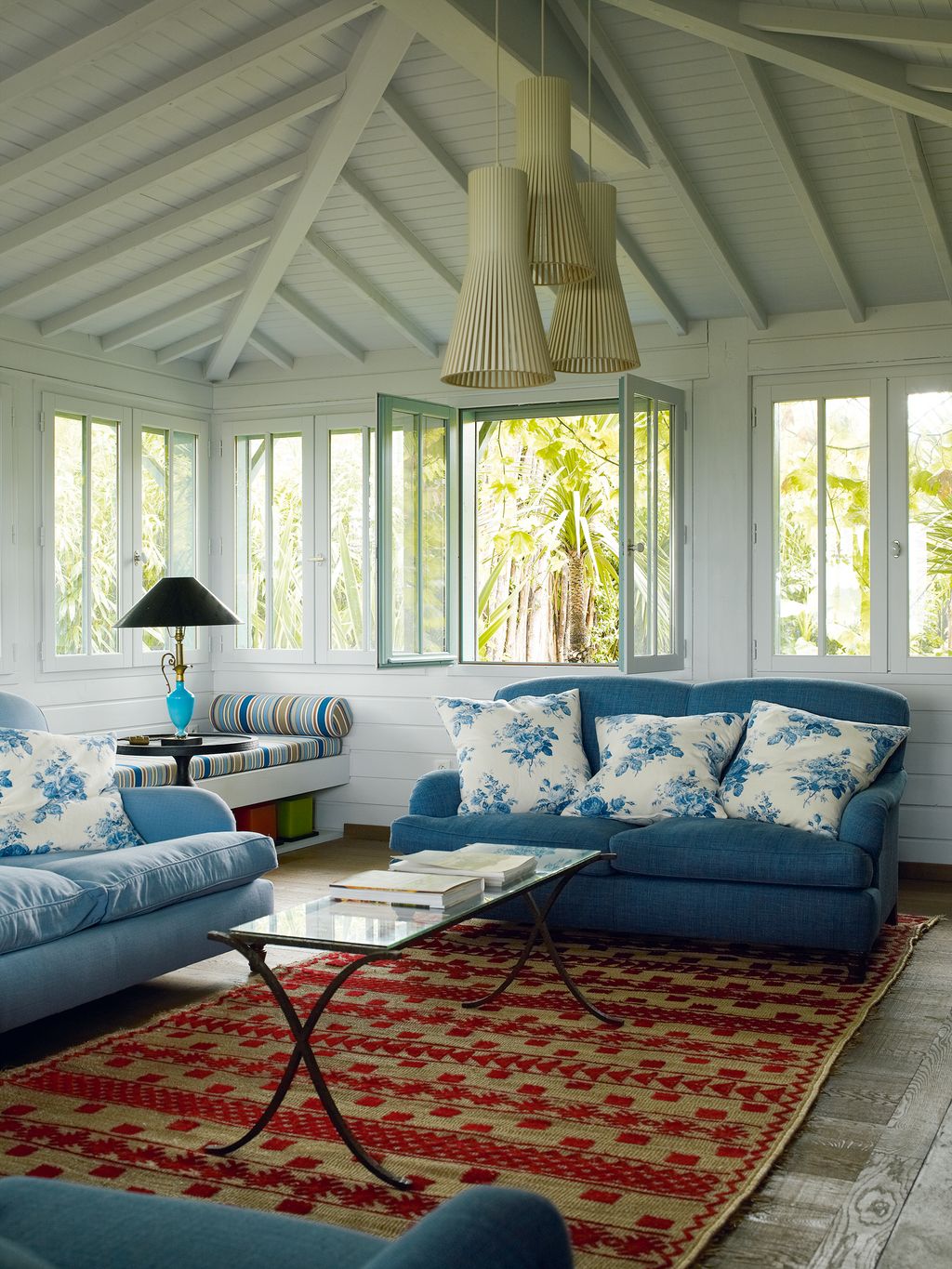 Image may contain Furniture Living Room Room Indoors Table Rug Coffee Table and Couch