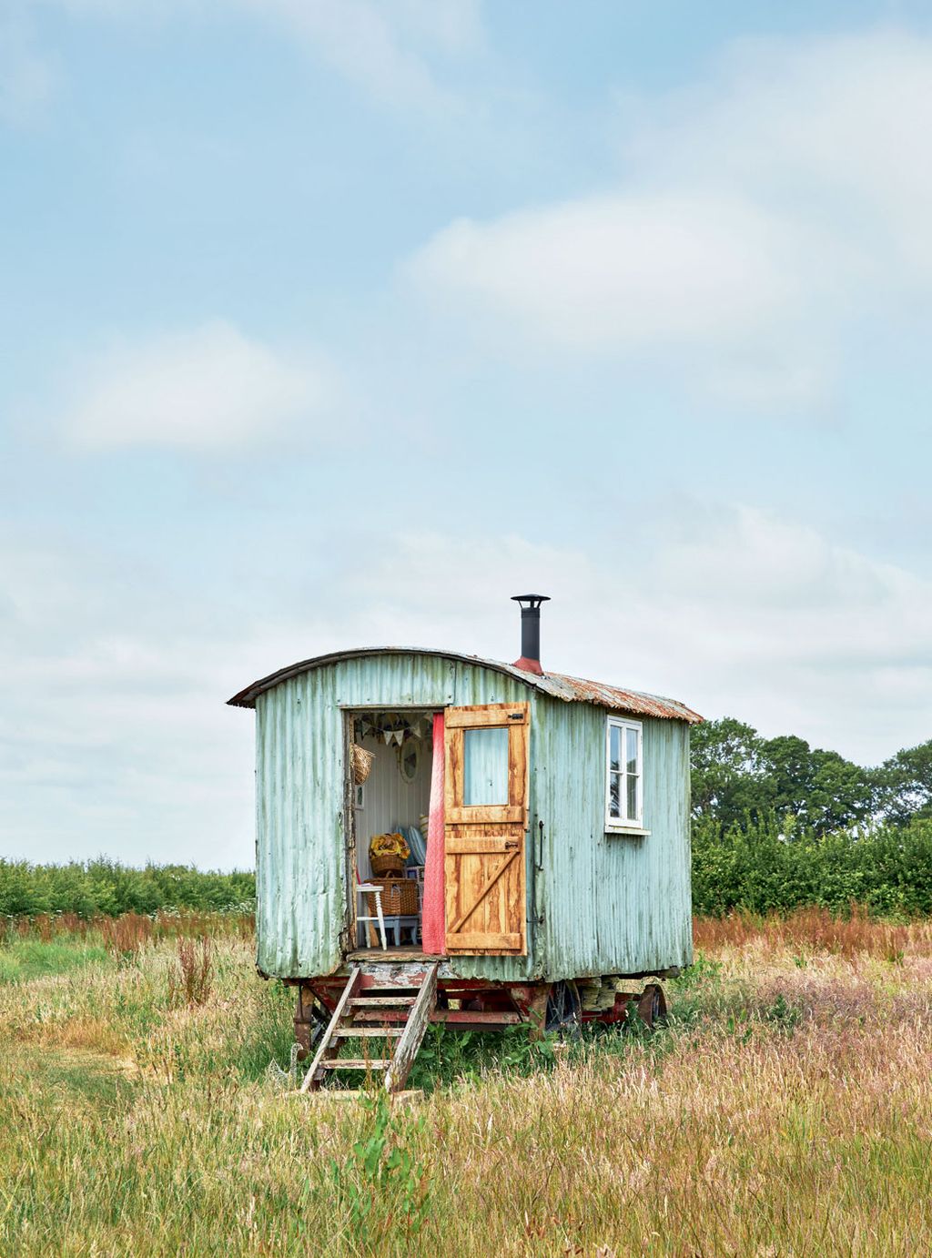 This vintage vehicle with a painted corrugatediron exterior that helps it blend into its setting was a 50thbirthday...