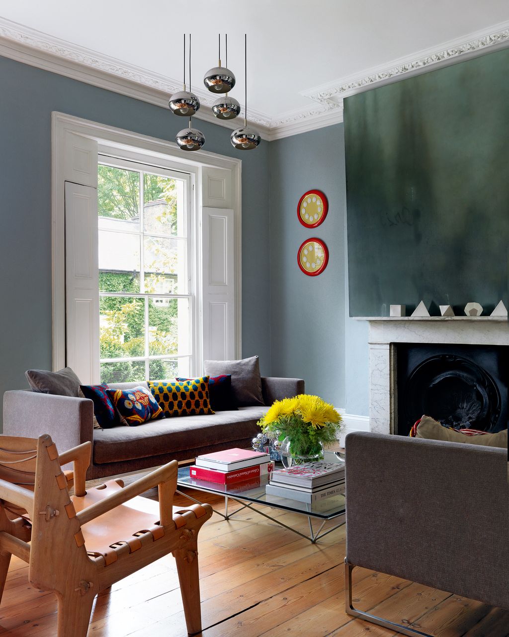 Image may contain Furniture Living Room Room Indoors Chair Table Couch Coffee Table and Interior Design