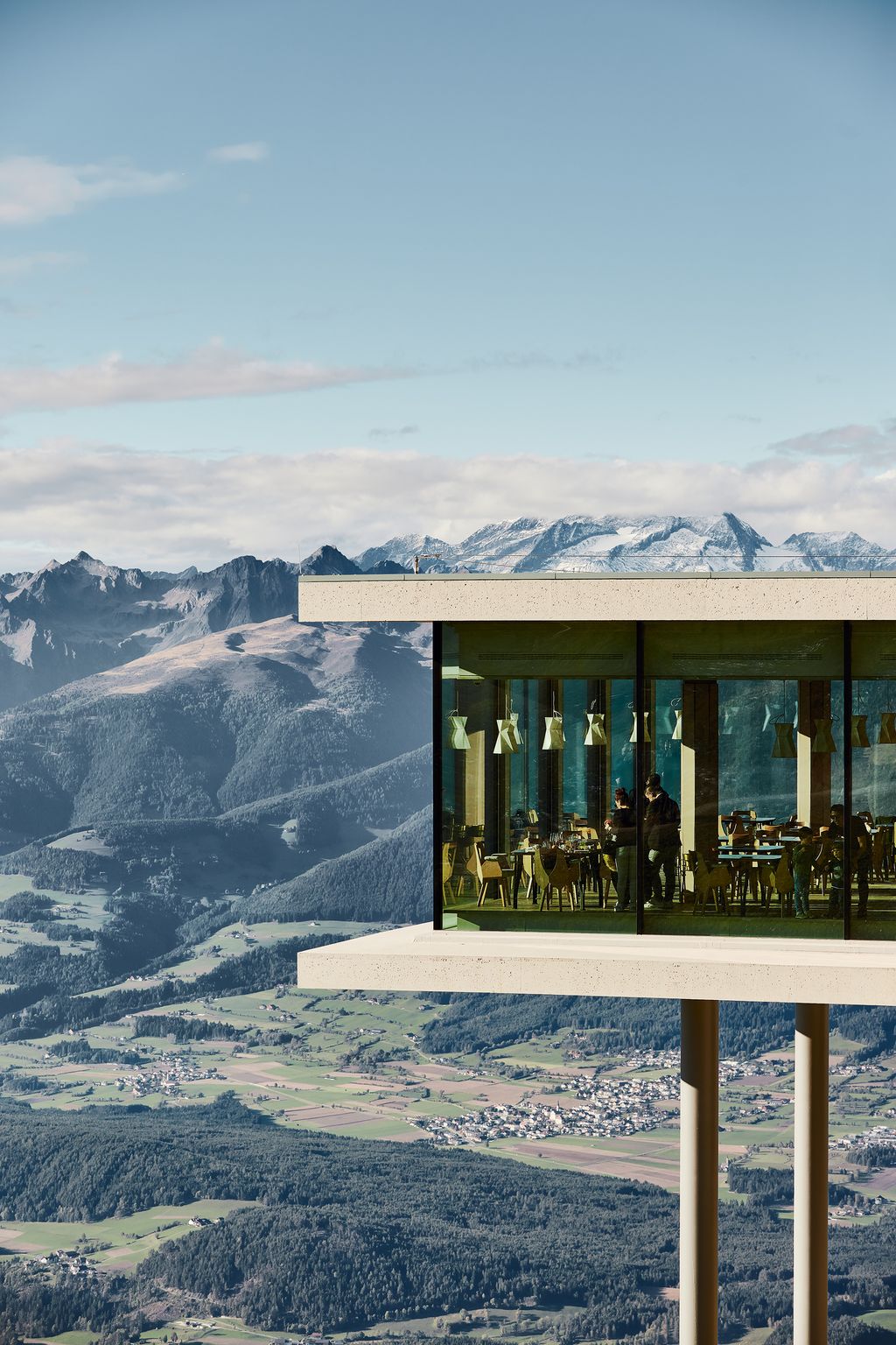 Image may contain Nature Outdoors Human Person Mountain Building Scenery and Ice