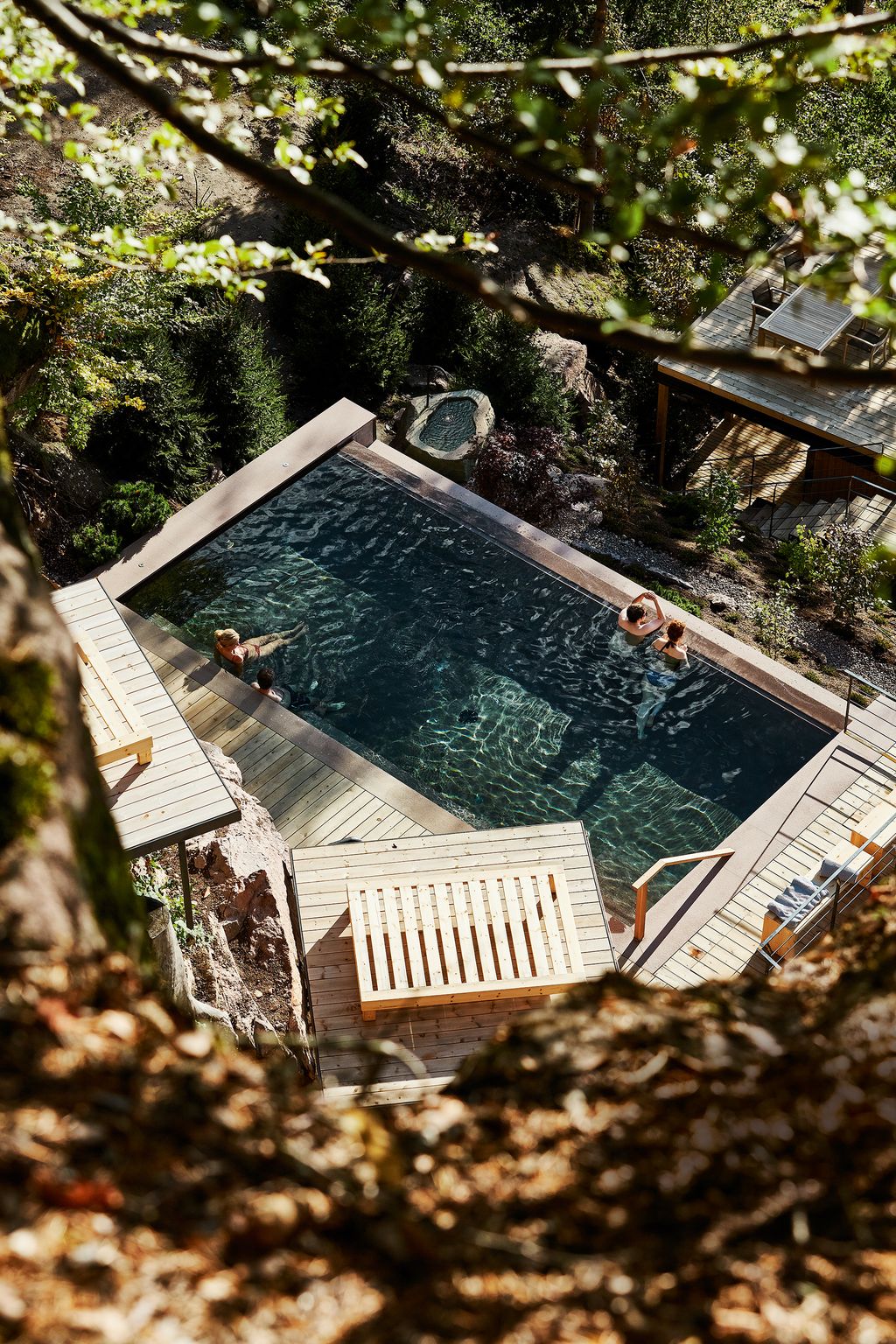 Image may contain Water Pool Outdoors Building Human Person Swimming Pool Hotel Resort and Nature