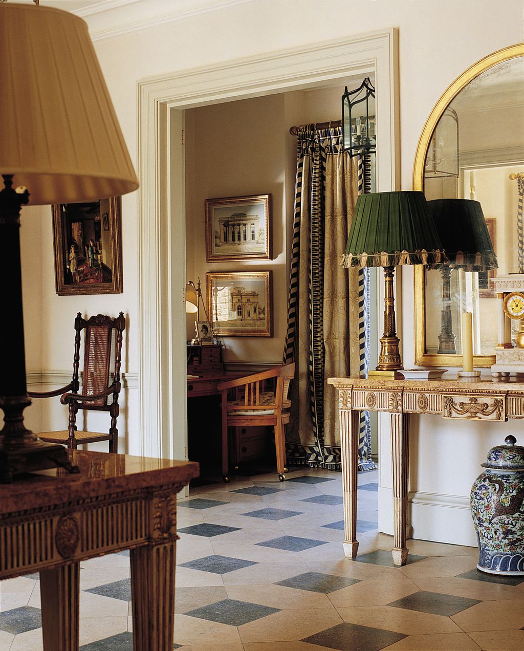 Image may contain Flooring Wood Furniture Lamp Table Lamp Floor Room Indoors Hardwood and Living Room