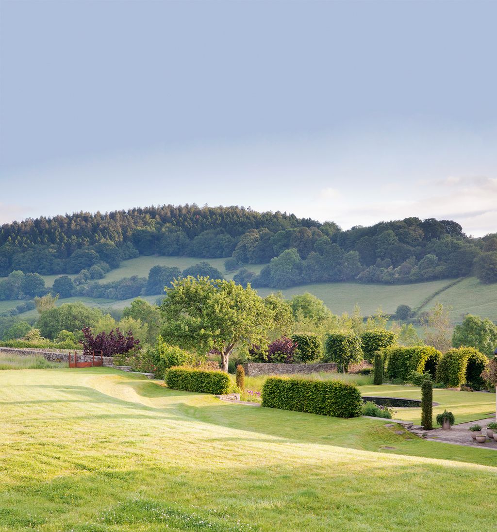 Perennials spill onto the Breedon gravel path.