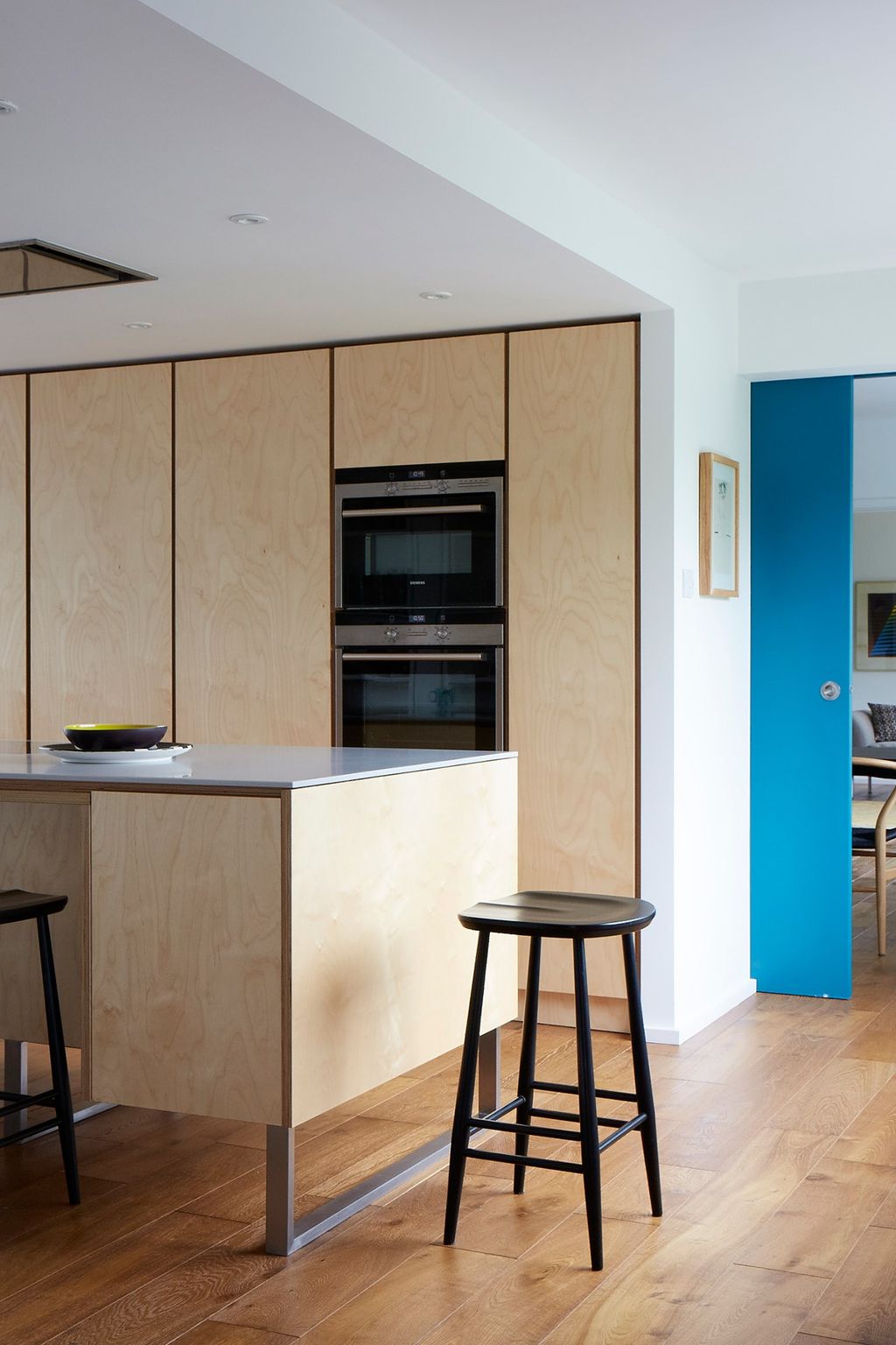 Image may contain Furniture Bar Stool Indoors Room Wood Oven Appliance and Kitchen