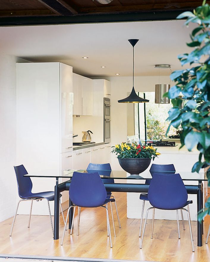 Image may contain Furniture Chair Room Indoors Interior Design Dining Table Table and Dining Room