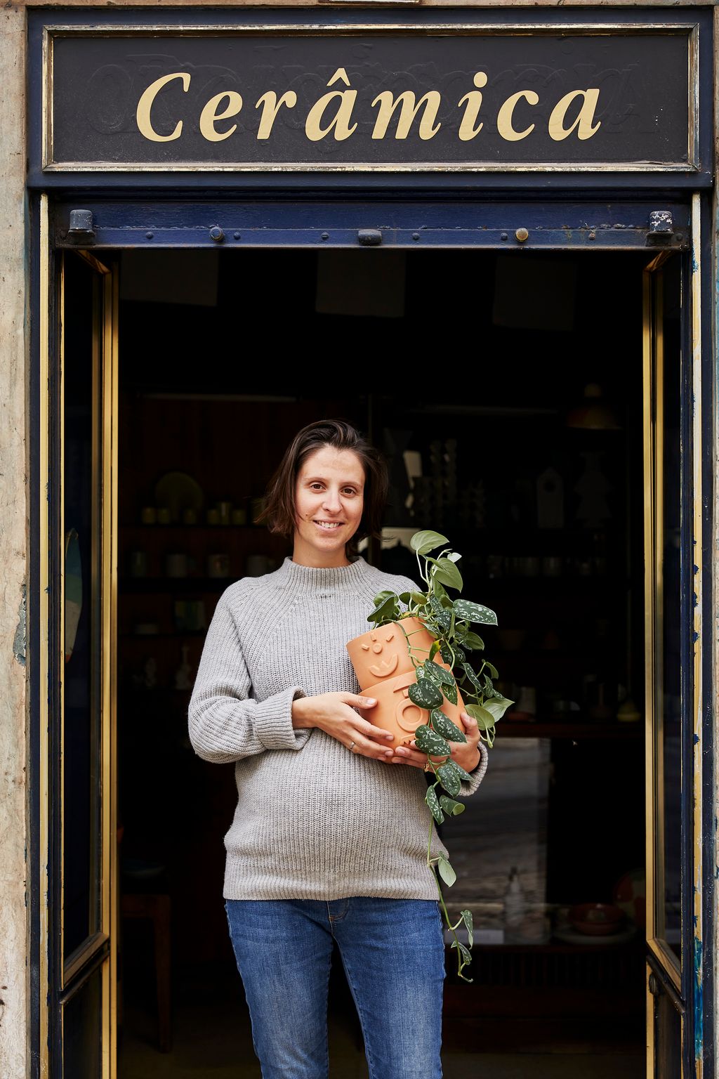 Image may contain Clothing Apparel Human Person Sleeve Long Sleeve Door and Sweater