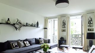 Image may contain Furniture Living Room Indoors Room Couch Table Coffee Table and Interior Design