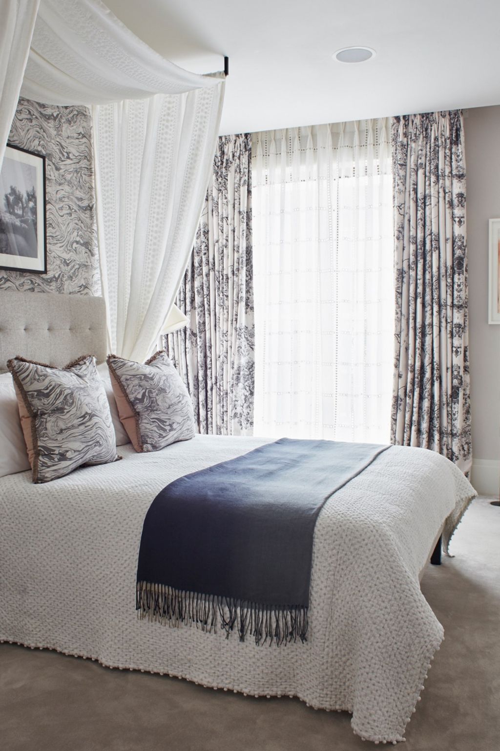 Image may contain Indoors Room Bedroom Furniture Bed Home Decor Cushion and Interior Design