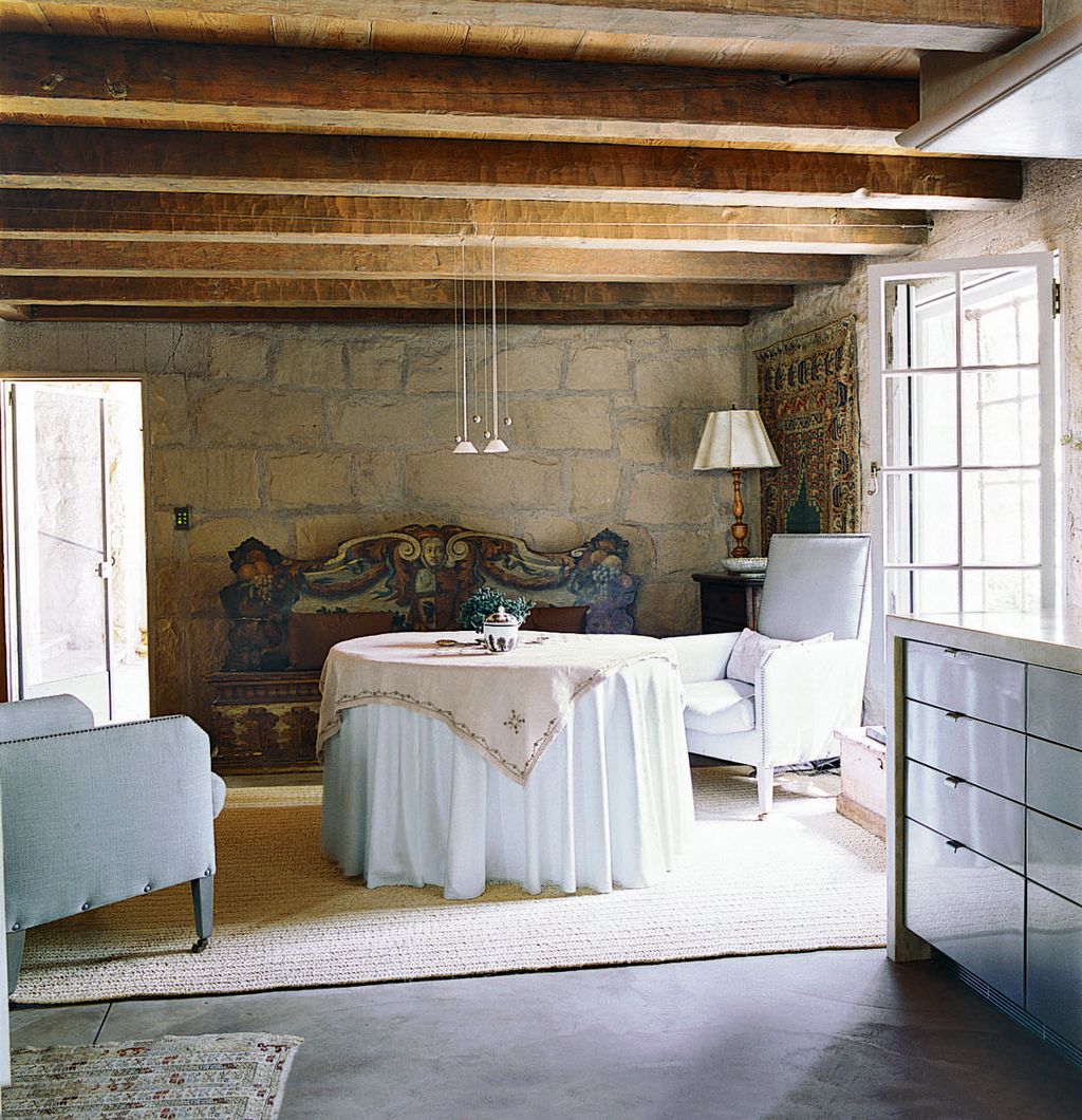 Image may contain Furniture Flooring Indoors Room Living Room Wood Floor Couch Bedroom Interior Design and Rug