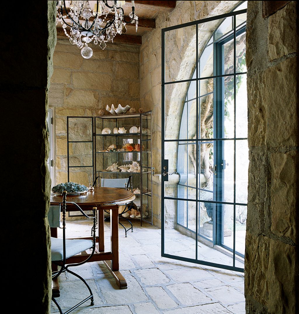 Image may contain Floor Lamp Wood Flooring Chandelier and Door