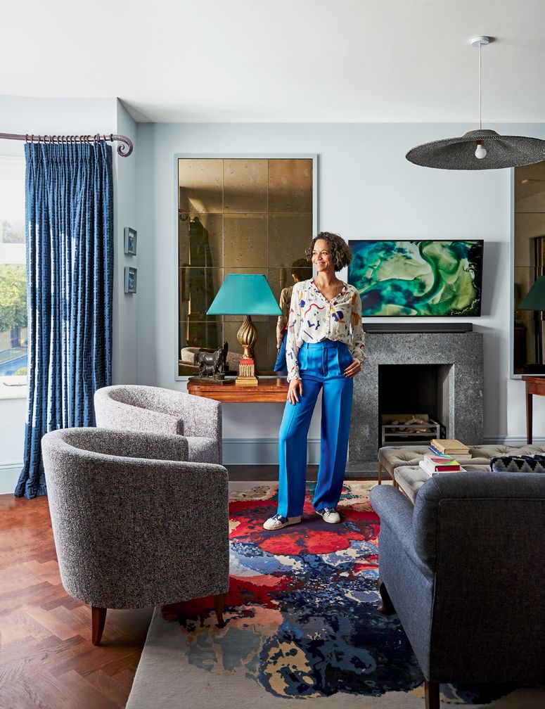 Image may contain: Furniture, Couch, Living Room, Room, Indoors, Human, Person, Home Decor, and Interior Design