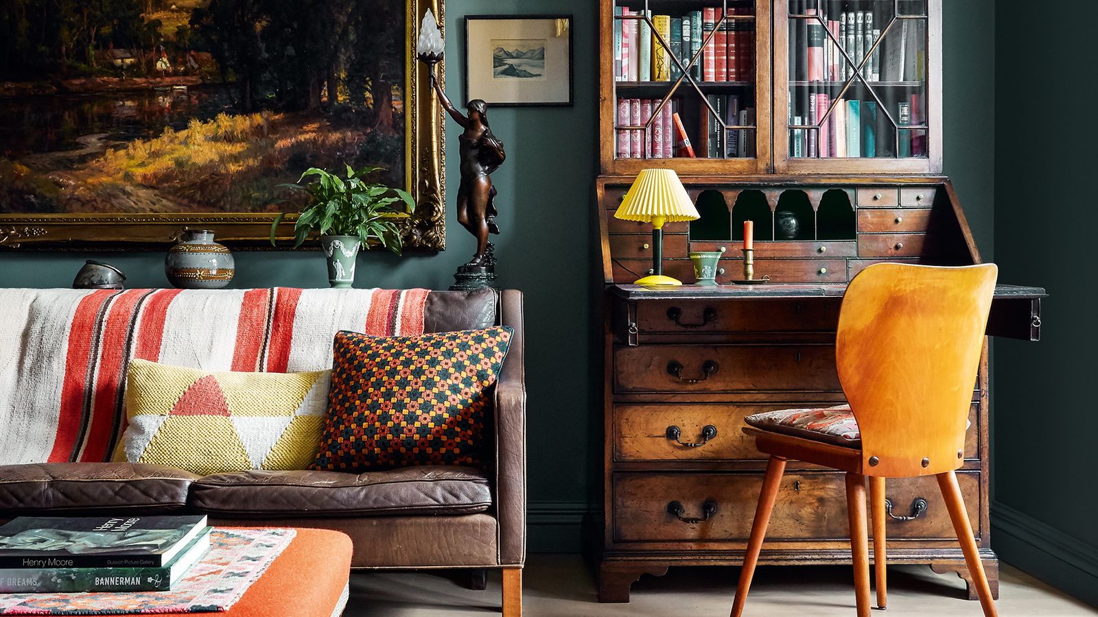 Image may contain: Furniture, Living Room, Room, Indoors, Couch, Table, Rug, Bookcase, and Chair